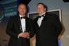 David Ibbotson, director of produce at Pauleys, is presented with the award by MVS Food Services managing director Hannes Martin