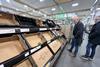BelOrta's commercial director Jo Lambrecht inspects empty shelves at Sainsbury's in London