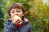 Boy eating apple