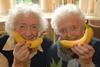 Joan Chapman, left, and Irene Burns Morton celebrated Fruity Friday with a smile last year