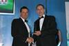 Tesco's David May presents last year's overall produce trader of the year award to Berryworld's Adam Olins