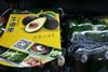 Mission Flag next to retail display of tray overwrapped avocados
