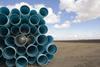GEN Agricultural irrigation piping stacked on farm_2924745