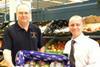John Worth with Tesco duty manager Matt Walters taking delivery of the first crate of the 2009 season
