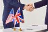 US UK agreement flags handshake