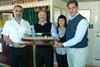 Captain Pejovic of the MSC Laura and Mike Economou, MSC director Cape Town, present a model of the MSC Laura to Capespan Exports’ Penny Thebus and Deon Joubert