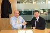 Morrisons' Neal Austin (l) shakes on it with Dolph Westerbos, CHEP EMEA group president
