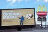 Australian macadamia nut grower Michael McMahon with the Original Macas billboard