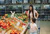 GEN US healthy eating supermarket mum daughter AdobeStock_590636842