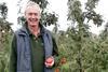 Clive Chandler with one of his prize-winning Jazz apples