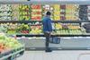 Supermarket shopper browsing fresh produce Adobe Stock