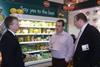 Chris Tune, left, and Nick Douglas, Del Monte's general manager at Methwold, right, discuss the company's new range with a potential customer at Food & Drink Expo.