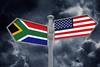 South Africa US signpost flags stormclouds Adobe Stock