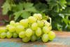 White grapes on wooden board Adobe