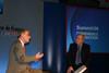 Rae, left, makes his point to ACS Summit 06 chairman John Waite, of Radio 4's You and Your's