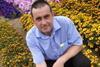T&M professional growers manager Nigel Judd at the trials site this week with ‘Mr Majestic’ - with highly contrasting striped flowers.