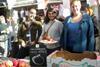 Portobello market manager Mark Atkinson with Local to London's Zeenat Anjari and Ruth Holbrook