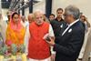 Prime Minister Modi (red vest)