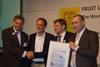 Eosta ceo Volkert Engelsman, far left, receives the certification from the TÜV Nord and Soil & More team