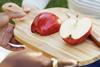 Envy apples on wooden board sliced Oppy