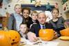 Dennis Hutchinson, managing director of JR Holland Food Services with staff and children from the Hill Court project supported by Children North East