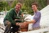 Nicola Bradley and Clive Mildenhall with the miniature pineapple at the Lost Gardens of Heligan