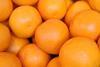Oranges clustered together closeup Adobe