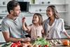 Family preparing healthy meal kitchen