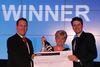 Val Newman collecting her award