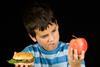 boy-choosing-burger-or-fruit-300x218