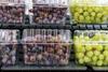 Grapes in punnets on supermarket shelves Adobe Stock