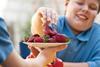 fat kid eating fruit