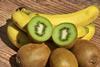 Kiwifruit and bananas on wooden board Adobe Stock