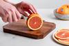 Cara Cara oranges being sliced Sunkist