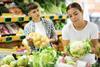 Buying vegetables in supermarket Adobe Stock