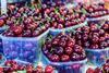 Cherries at a market in Barcelona Spain Adobe Stock