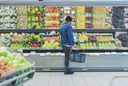 Supermarket shopper browsing fresh produce Adobe Stock