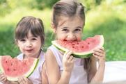 Children eating watermelon Adobe Stock