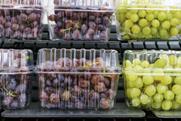 Grapes in punnets on supermarket shelves Adobe Stock