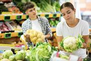 Buying vegetables in supermarket Adobe Stock