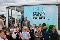 Andy Barrie (r) and Magdalena Jurczuk (l) of AP Barrie & Co introduce Scottish kids to their strawberry crop at the Highland Show