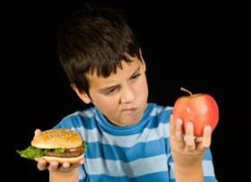 boy-choosing-burger-or-fruit-300x218