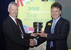 Stuart Wales receives the award from Allan Stevenson