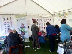 Adults and children try crafting pictures of cucumbers at last year's festival