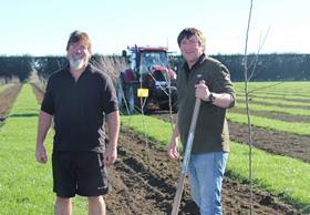 Bostock New Zealand Orchard Managers Shane Crawford and Craig Treneman planting new apple varieties in Hawkeâ€™s Bay