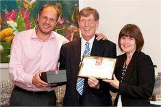 Lee Turner and Thersesa Huxley of Sainsbury's collected the gong from Adrian Barlow (centre)