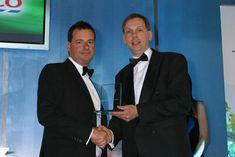 Tesco's David May presents last year's overall produce trader of the year award to Berryworld's Adam Olins