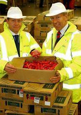 Matt George, general manager, Christian Salvesen (left) and Gerry Mundy, global perishables manager, BA (right) inspect fresh produce arriving in the UK.
