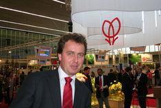 Timo Huges and the world-renowned red tulip logo