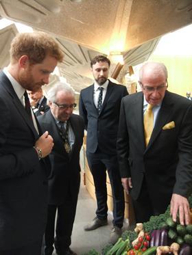 HRH Prince Harry stops to admire the Fruiterers' fresh produce